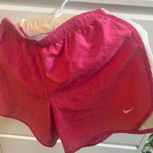 Nike girls athletic shorts, pink with white trim, size XL